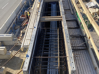 Overhead look down into pier forms and rebar.